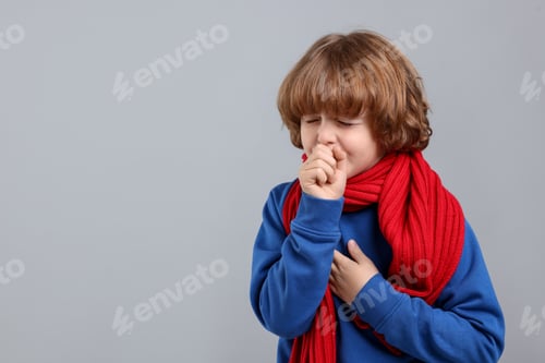 Preview: Little boy coughing on light background, space for text. Cold symptom