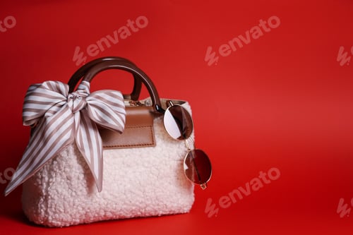 Preview: Stylish handkerchief, sunglasses and bag on red background, space for text