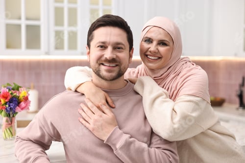 Preview: Portrait of happy muslim couple at home