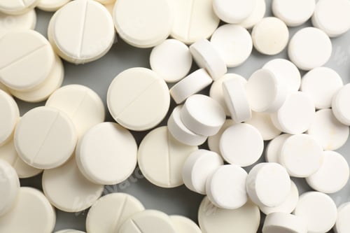 Preview: Many pills on light grey background, flat lay
