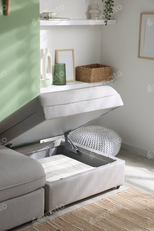 Preview: Modular sofa with open storage section in living room