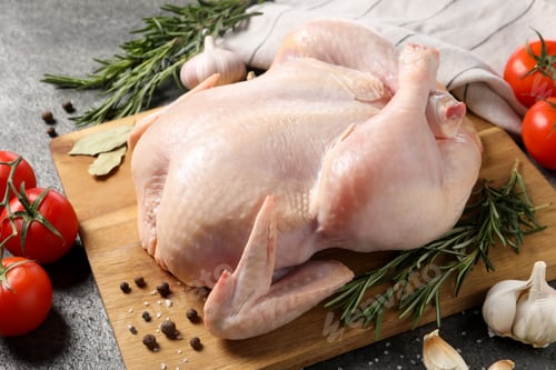 Preview: Fresh raw chicken with spices and vegetables on grey table