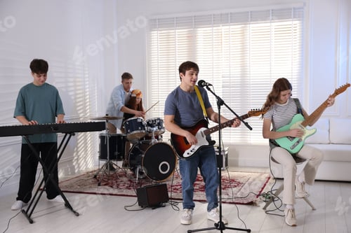 Preview: Teenage music band practicing their performance indoors