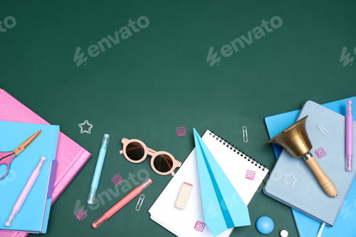 Preview: School holidays. Sunglasses, paper plane, golden bell and stationery on green background, flat lay.