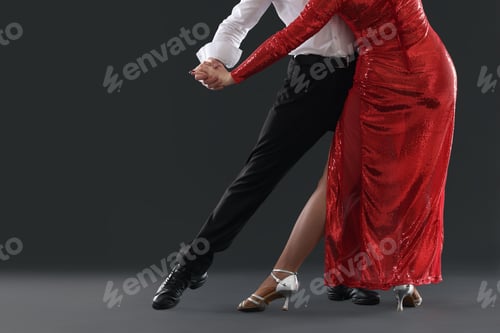 Preview: Couple of professional dancers on dark background