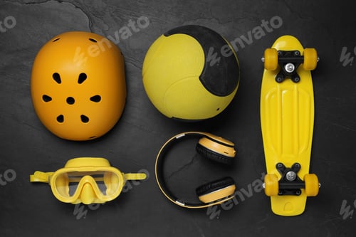 Preview: Sports equipment and headphones on dark textured floor, flat lay