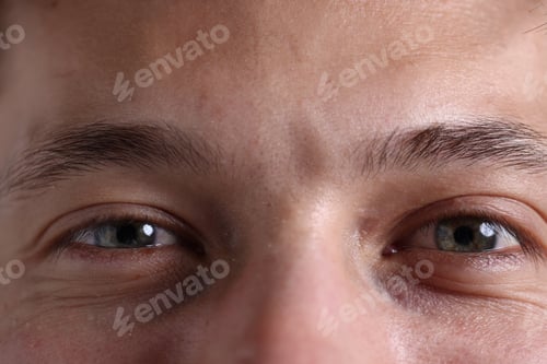 Preview: Macro view of young man with beautiful eyes