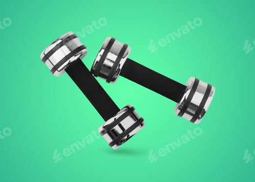 Preview: Pair of dumbbells falling on turquoise background. Weight equipment