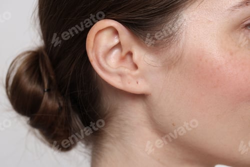 Preview: Woman with normal skin on light background, closeup