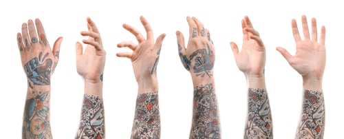 Preview: Man showing his tattooed hands on white background, set