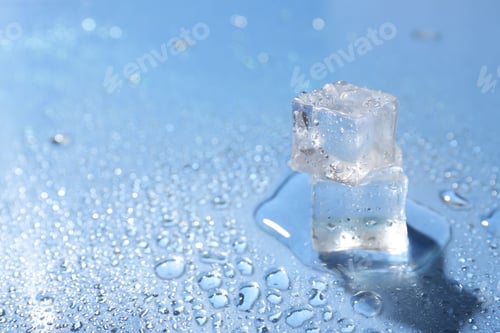 Preview: Melting ice cubes and water drops on light blue background, closeup. Space for text