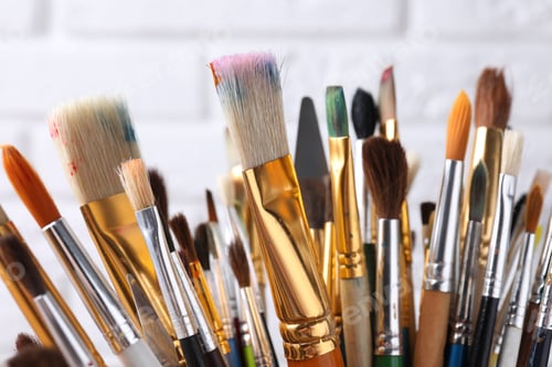 Preview: Different paint brushes on blurred background, closeup