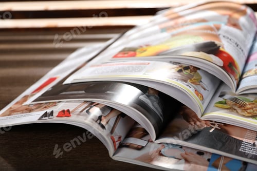 Preview: Many lifestyle magazines on wooden table, closeup