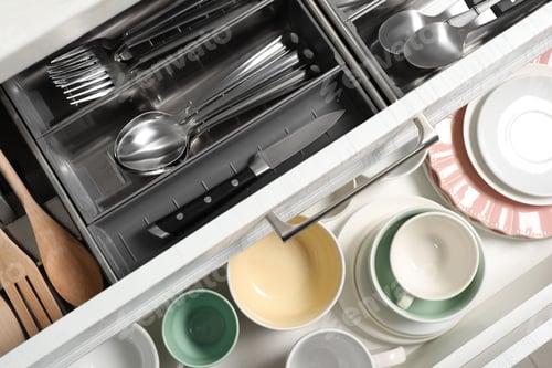 Preview: Ceramic dishware, utensils and cutlery in drawers, top view
