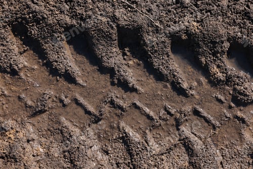 Preview: Muddy road with tire tracks as background, top view