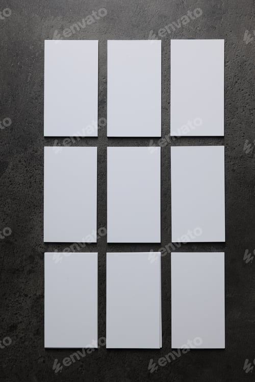 Preview: Blank business cards on grey textured background, top view. Mockup for design