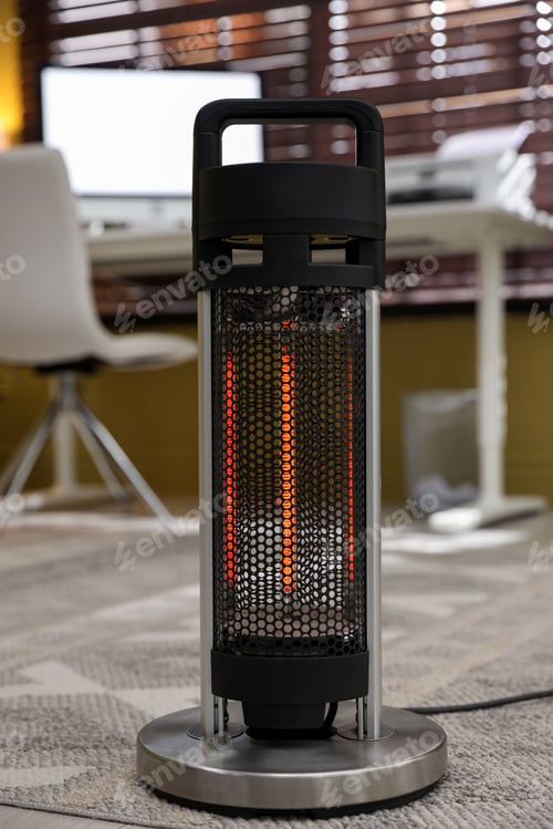 Preview: Modern portable electric heater in room, closeup