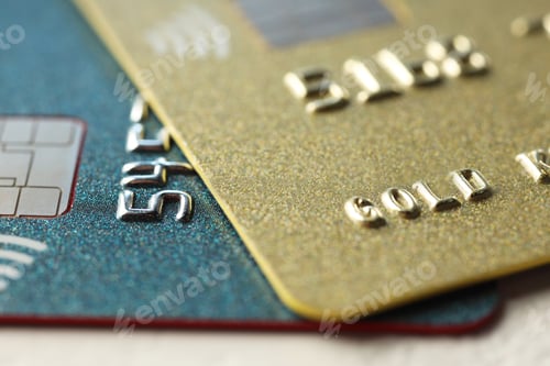 Preview: Two plastic credit cards on table, macro view