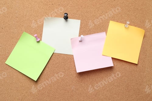 Preview: Blank paper notes pinned to cork board