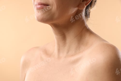 Preview: Woman with healthy skin on beige background, closeup