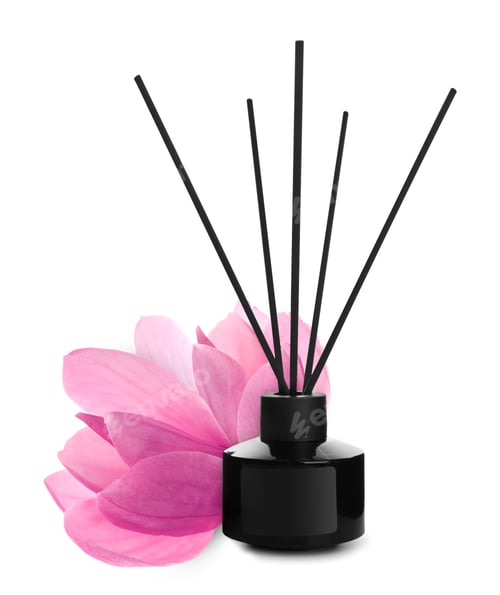 Preview: Aromatic reed freshener and magnolia flower isolated on white. Floral home fragrance