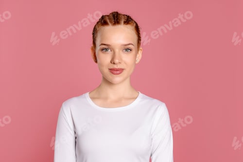 Preview: Portrait of teenage girl with beautiful braids on pink background