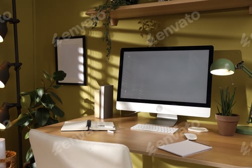 Preview: Stylish workplace with modern computer and stationery on wooden table indoors, closeup