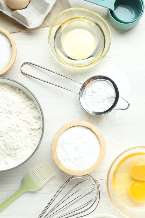 Preview: Baking powder and other ingredients on white wooden table, flat lay