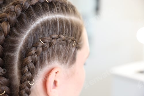Preview: Teenage girl with beautiful braids indoors, closeup. Space for text