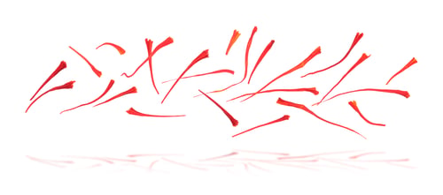 Preview: Saffron falling against white background. Aromatic spice