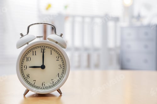 Preview: Alarm clock on table in nursery, closeup. Space for text
