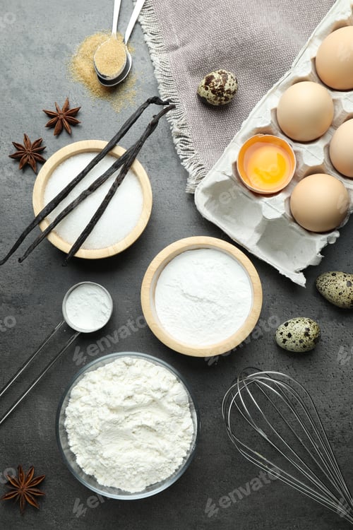 Preview: Baking powder and other ingredients on grey table, flat lay