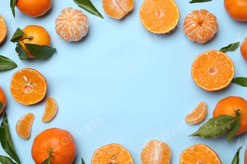 Preview: Fresh ripe tangerines and green leaves on light blue background, flat lay. Space for text