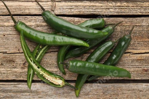 Preview: Fresh green chili peppers on wooden table, top view