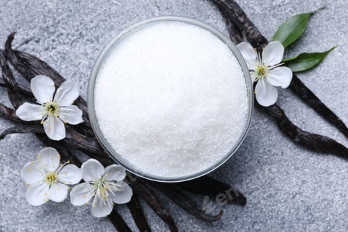 Preview: Vanilla sugar in glass bowl, pods and flowers on grey table, flat lay