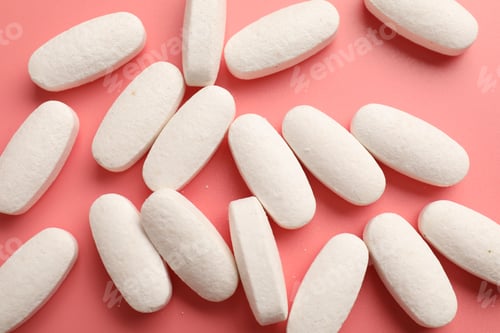 Preview: Many pills on pink background, flat lay