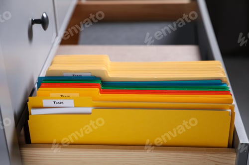 Preview: Tax. Many folders in drawer of cabinet in office, closeup