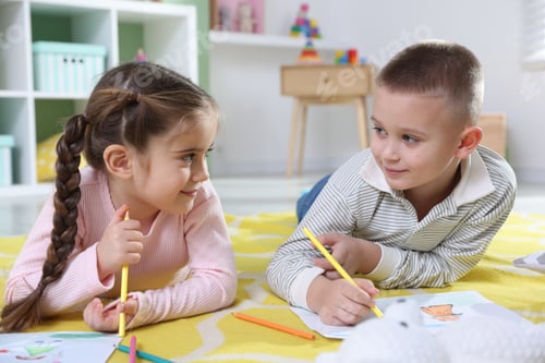 Preview: Children drawing with pencils on floor at home
