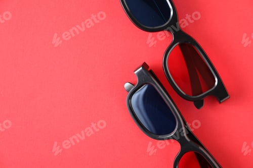 Preview: 3D glasses on red background, flat lay. Space for text