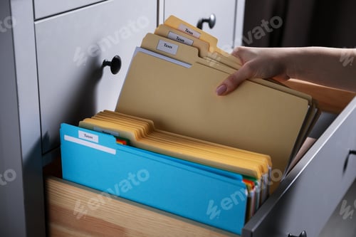 Preview: Tax. Woman taking folders from drawer of cabinet in office, closeup