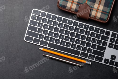 Preview: Office supplies on dark leather desk
