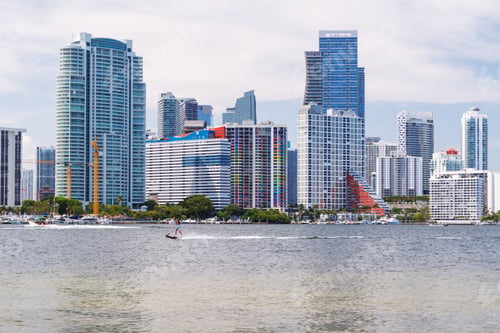 Preview: Modern skyline of Miami with towering skyscrapers, tropical vibe, and waterfront views