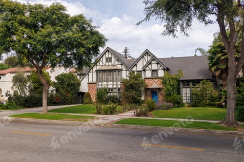 Preview: Modern suburban houses with cars in quiet residential street
