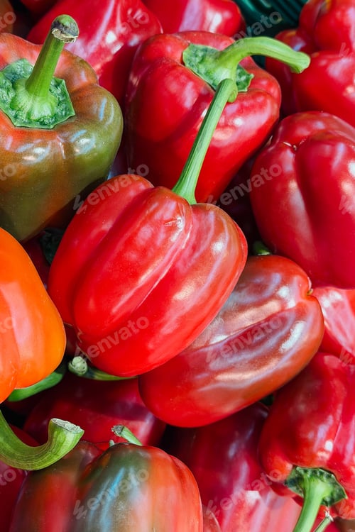 Preview: Fresh red bell peppers piled together creating a texture background