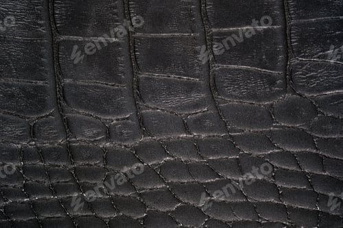 Preview: Black crocodile leather texture close up with embossed reptile scales and matte surface finish