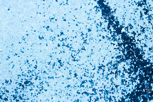 Preview: Close up surface of light blue glitter with scattered dark blue particles for backgrounds
