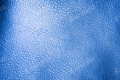 Close-up Texture of Vivid Blue Leather with Intricate Grain