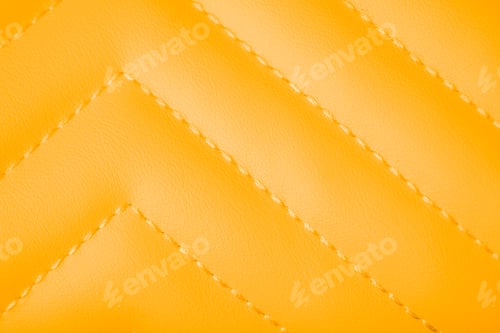 Preview: Vivid orange yellow quilted faux leather texture with elegant diagonal stitching patterned backgroun