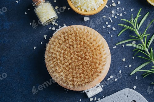 Preview: Natural spa items with bath brush and bath salts on dark background