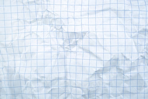 Preview: Wrinkled graph paper background with blue grid lines